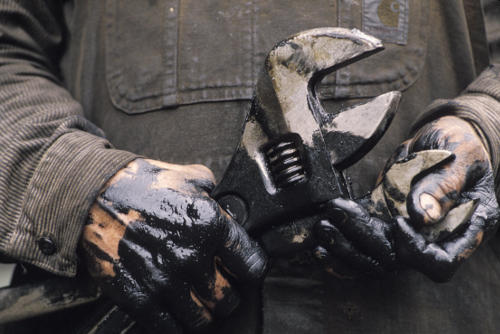 worker with oily hands